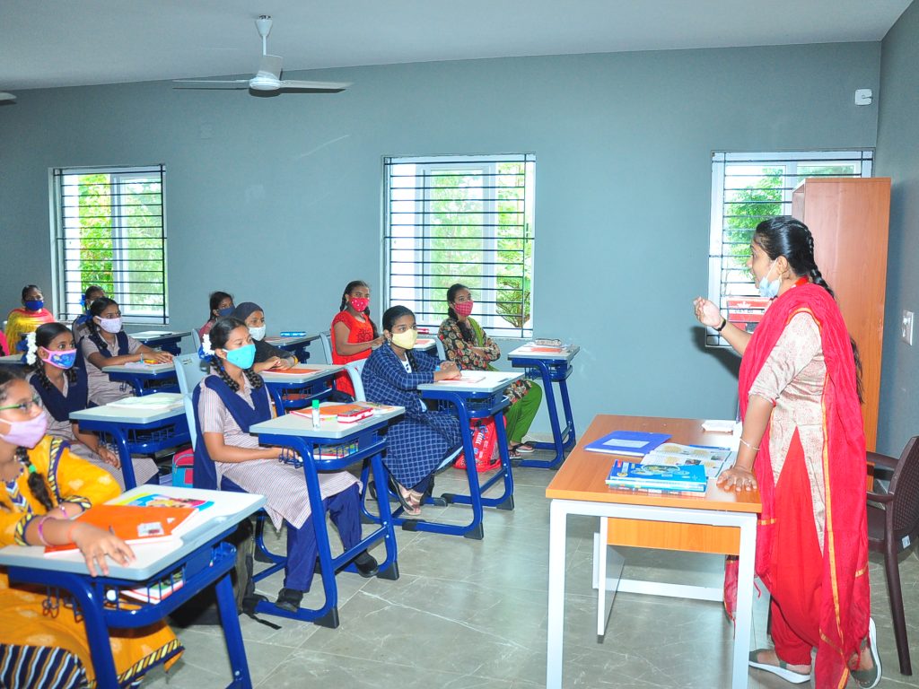 36Class room pic with red dressed madam